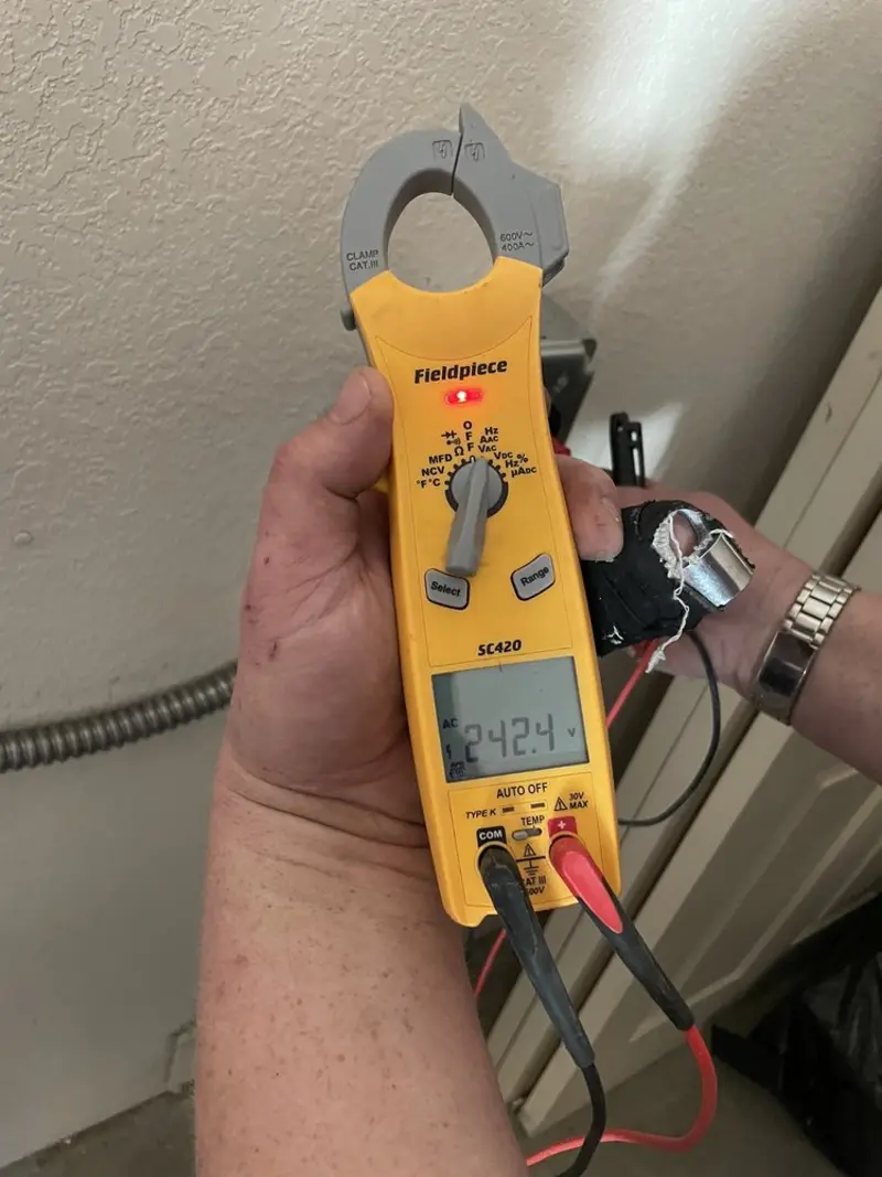 Voltage testing with clamp meter during Outlet Installation in La Porte